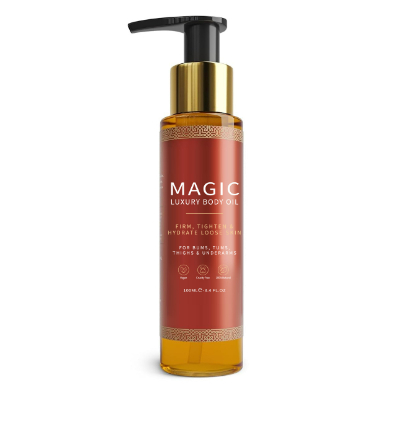 Bottle of Magic Luxury Body Oil with pump on a white background