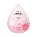 Pink essence cream container with cherry blossom designs on a white background