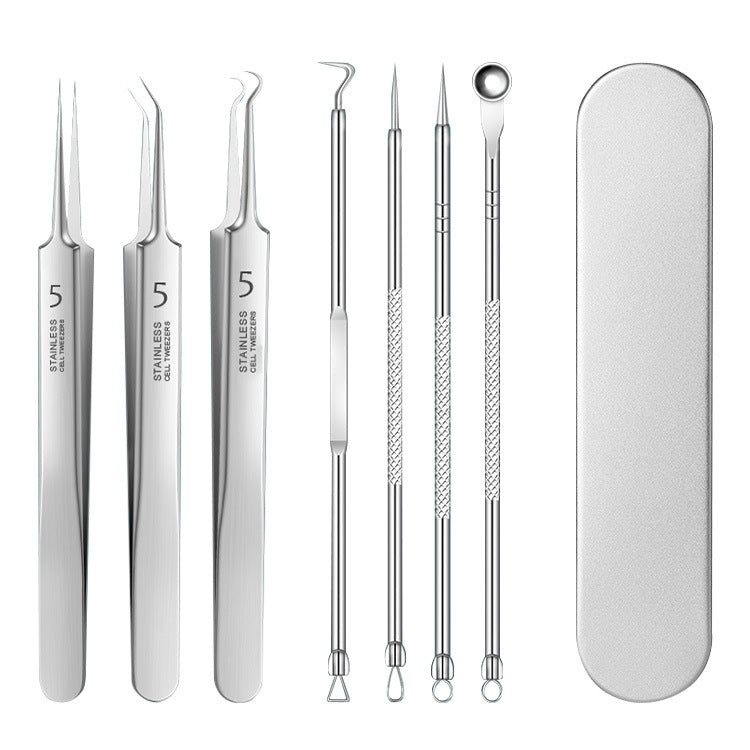 Set of stainless steel facial cleansing tools with a case on a white background