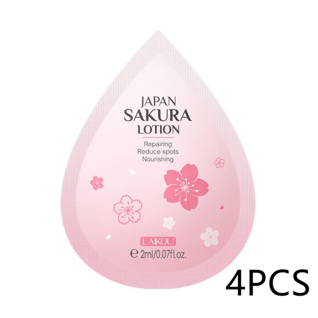Pink drop-shaped container labeled 'Japan Sakura Lotion' with cherry blossom designs on a white background.