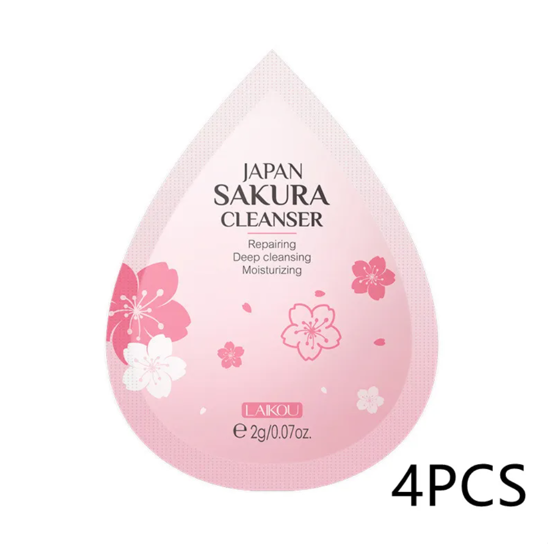 Pink cleanser packaging with cherry blossom design and 'Japan Sakura Cleanser' text on a white background.