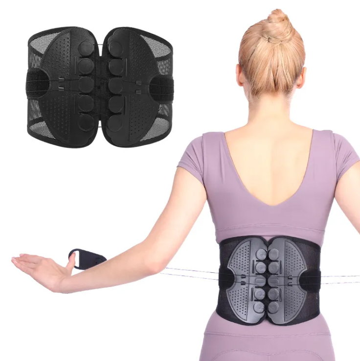 Black back brace worn by a person on a white background