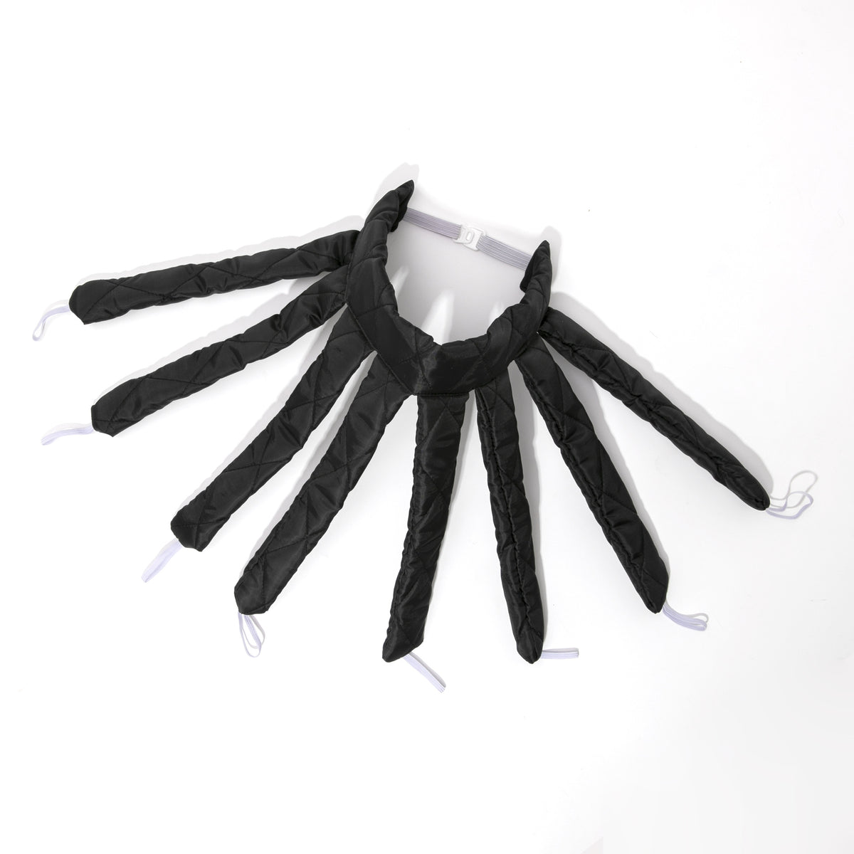 Black spider-shaped toy on a white background