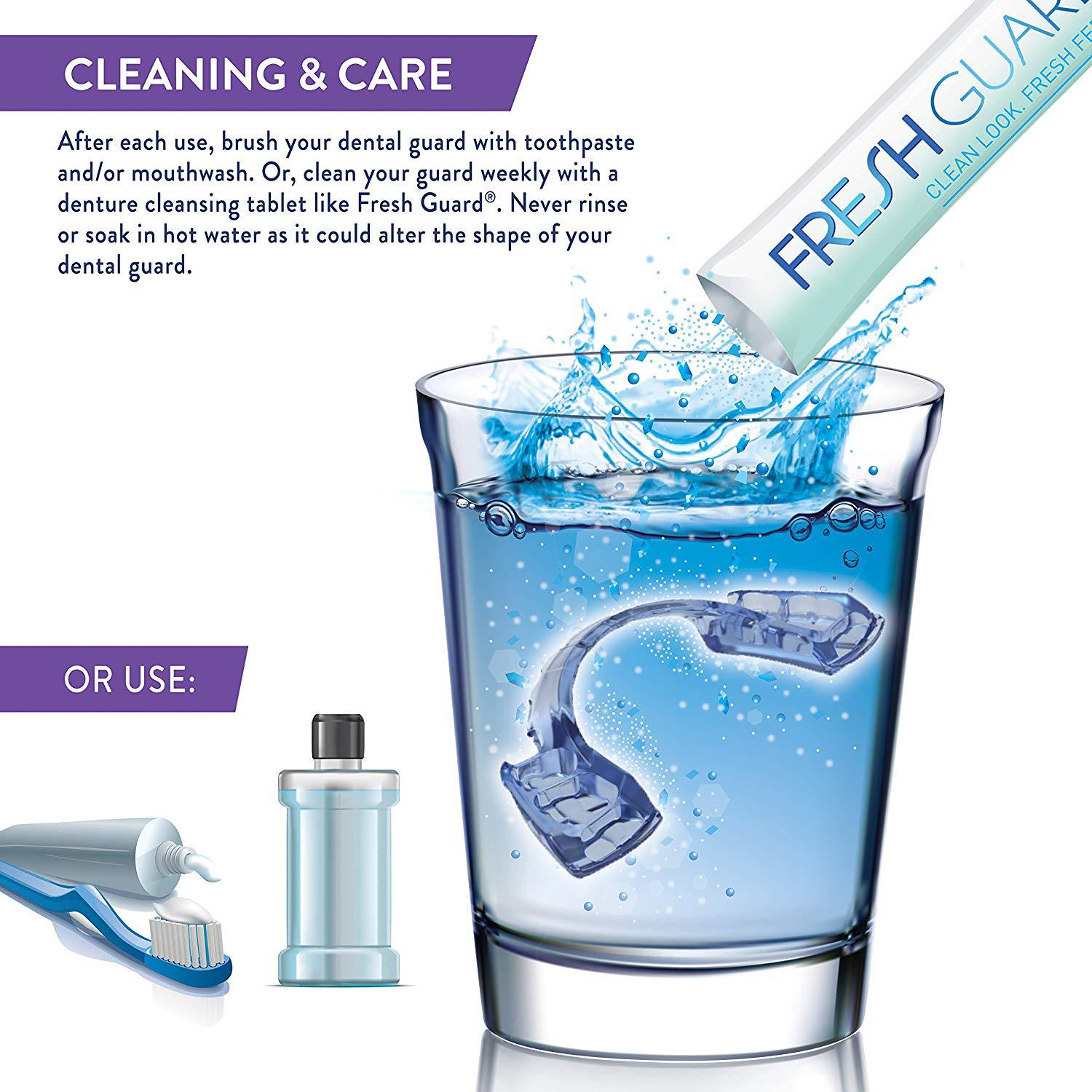 Dental guard being cleaned with water and a Fresh Guard product in a glass.