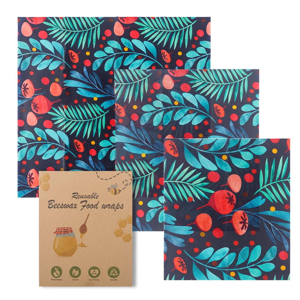 Reusable beeswax food wraps with a colorful leaf pattern on a white background