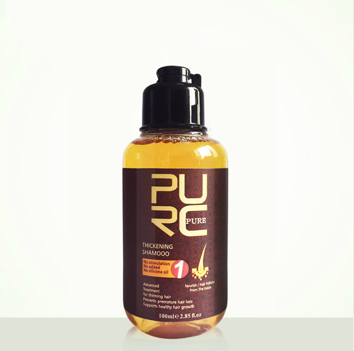 A bottle of PURC Pure Thickening Shampoo with a black cap and a dark brown label, containing amber-colored liquid, shown on a plain white background.