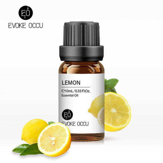 Lemon essential oil bottle with lemons and leaves on a white background, featuring Evoke Occu branding.