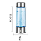 Glass water bottle with blue liquid and metal cap, showing dimensions on a white background