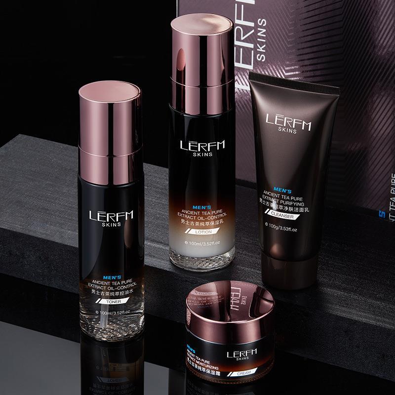 Collection of Men's skincare products on a dark surface with a black background.