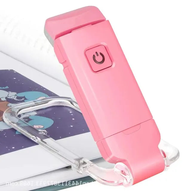 Pink handheld device with a power button on a white background