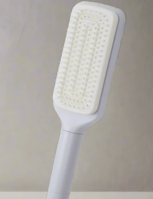 White handheld brush with bristle head
