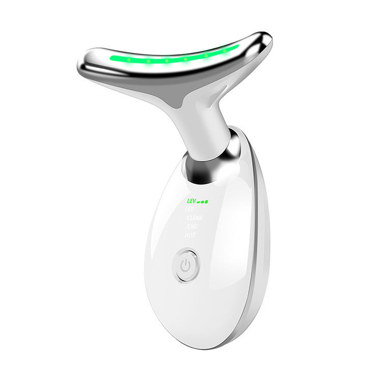White electronic device with a green light on a white background